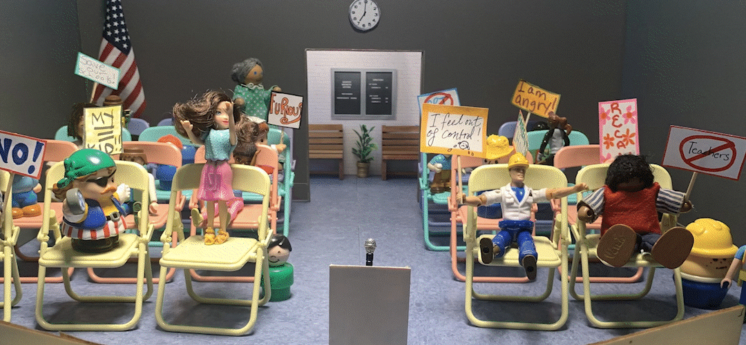 Animated gif of "little people" toys at a school board meeting