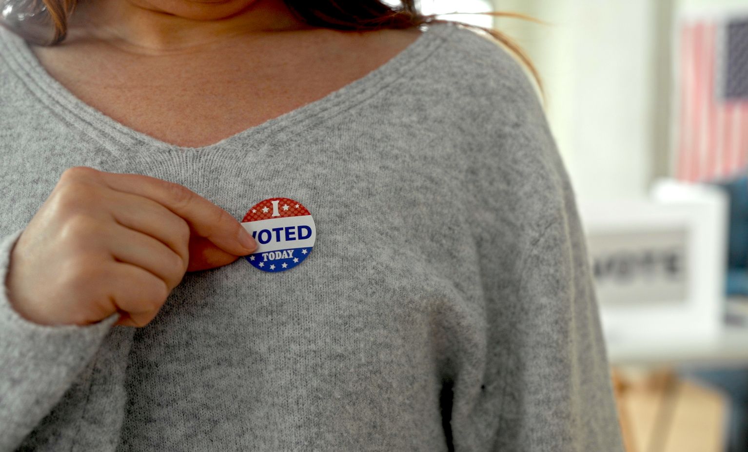 Woman wearing "I Voted" sticker